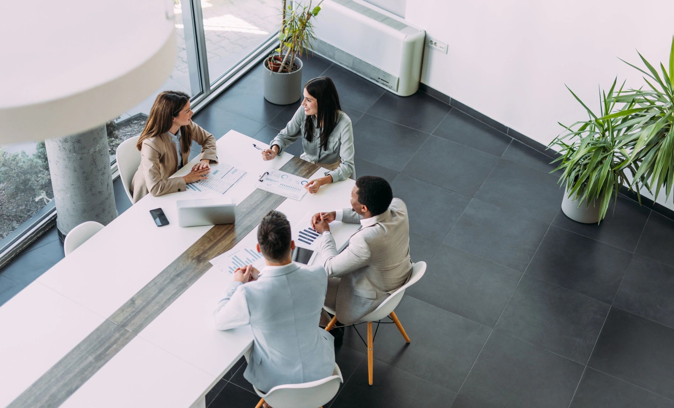 Business team meeting in an office about Homra Insurance Goup